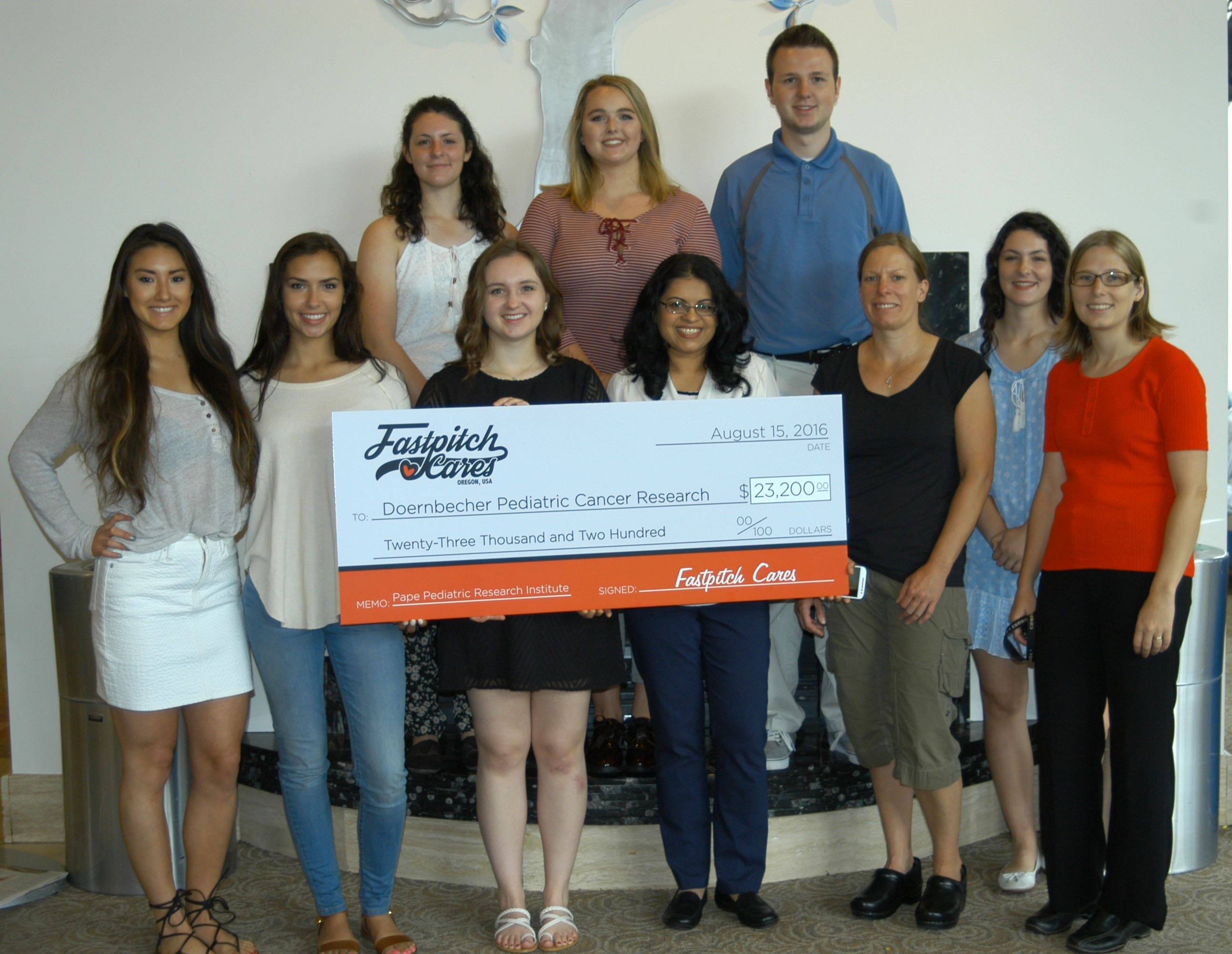 Members of our Xiologix family at Fastpitch Cares Check Presentation!
