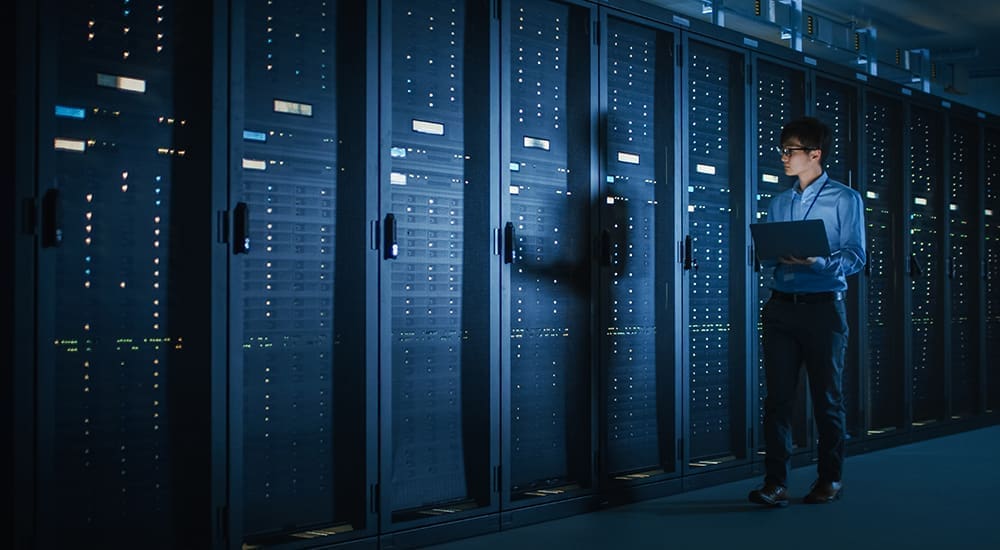 In,Dark,Data,Center:,Male,It,Specialist,Walks,Along,The